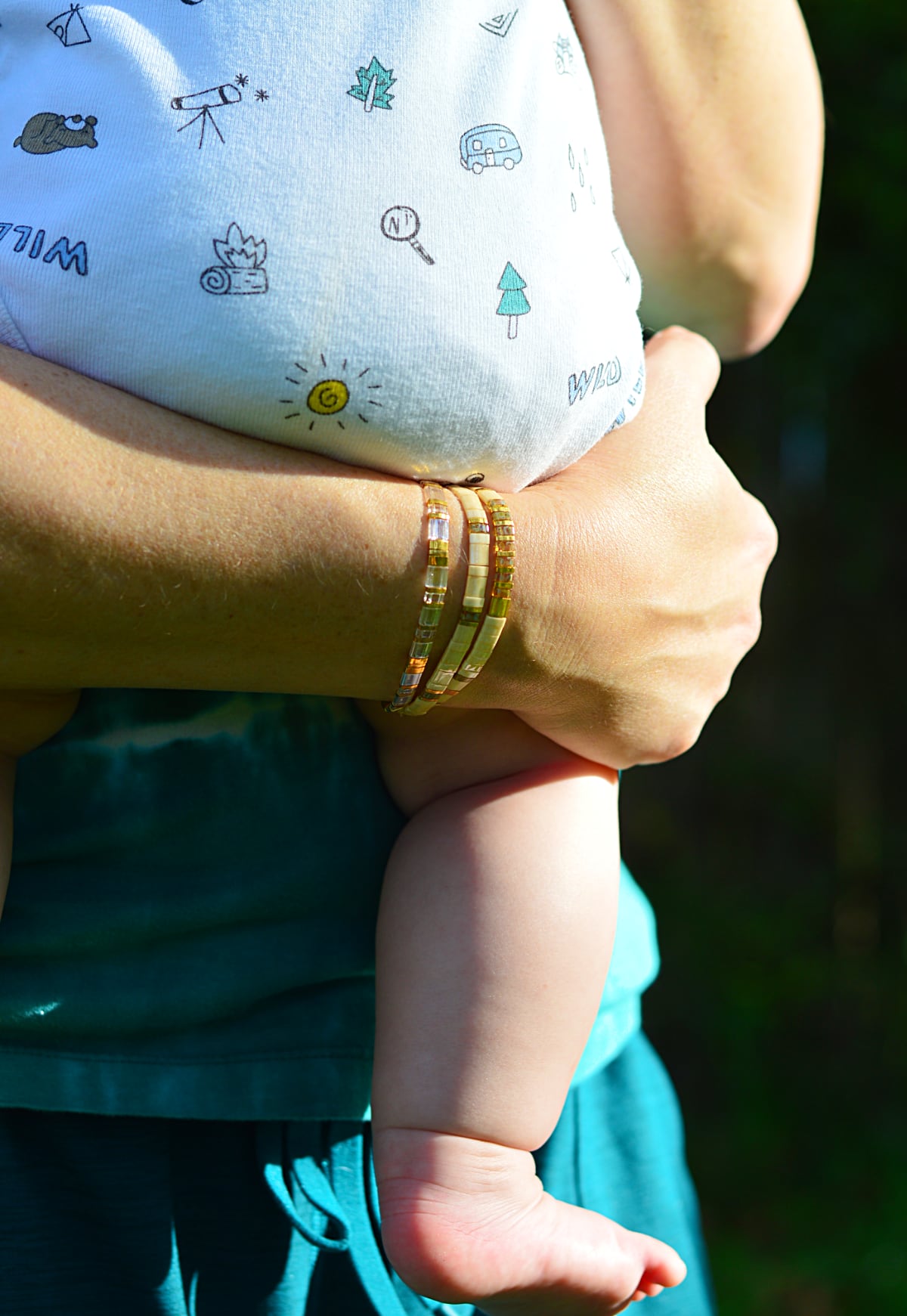 Coast + Cove bracelets designed in Florida, and baby-butt approved! Soft materials lie flat against the skin when carrying that baby around.
