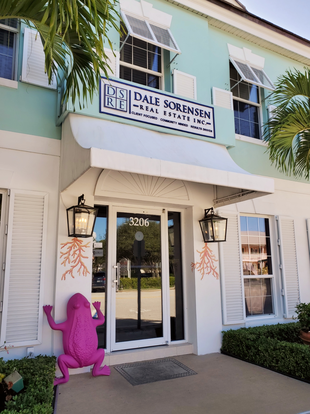 Downtown Vero Beach giant pink frog at real estate office entry
