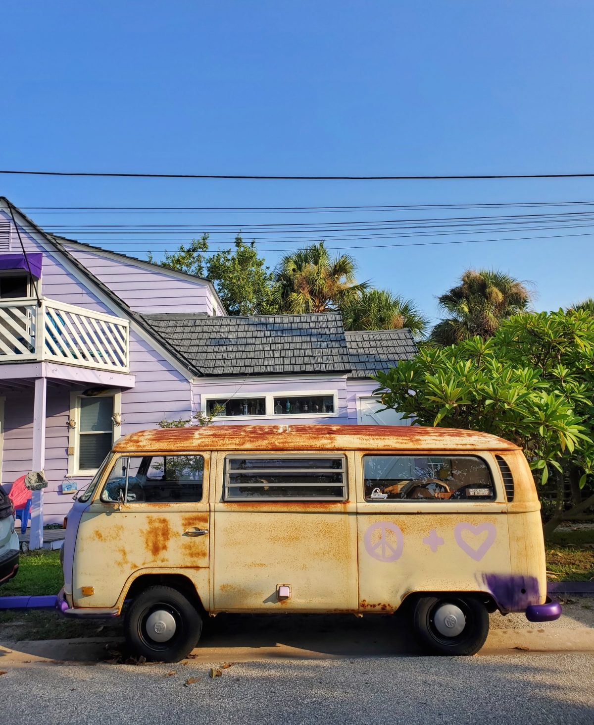 Vintage van next to purple cottage in Sunset Beach